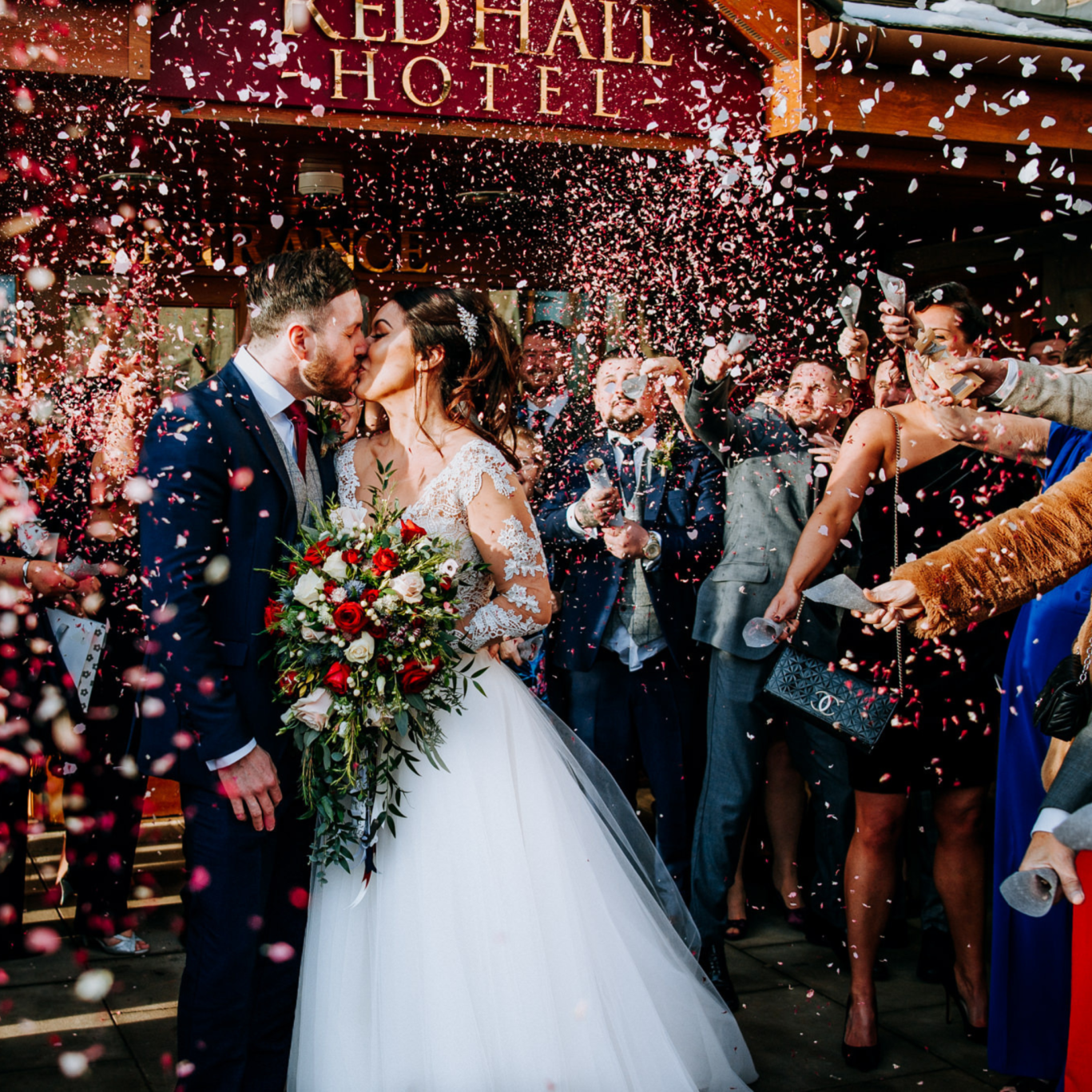 Bride and groom celebrating at Red Hall Hotel